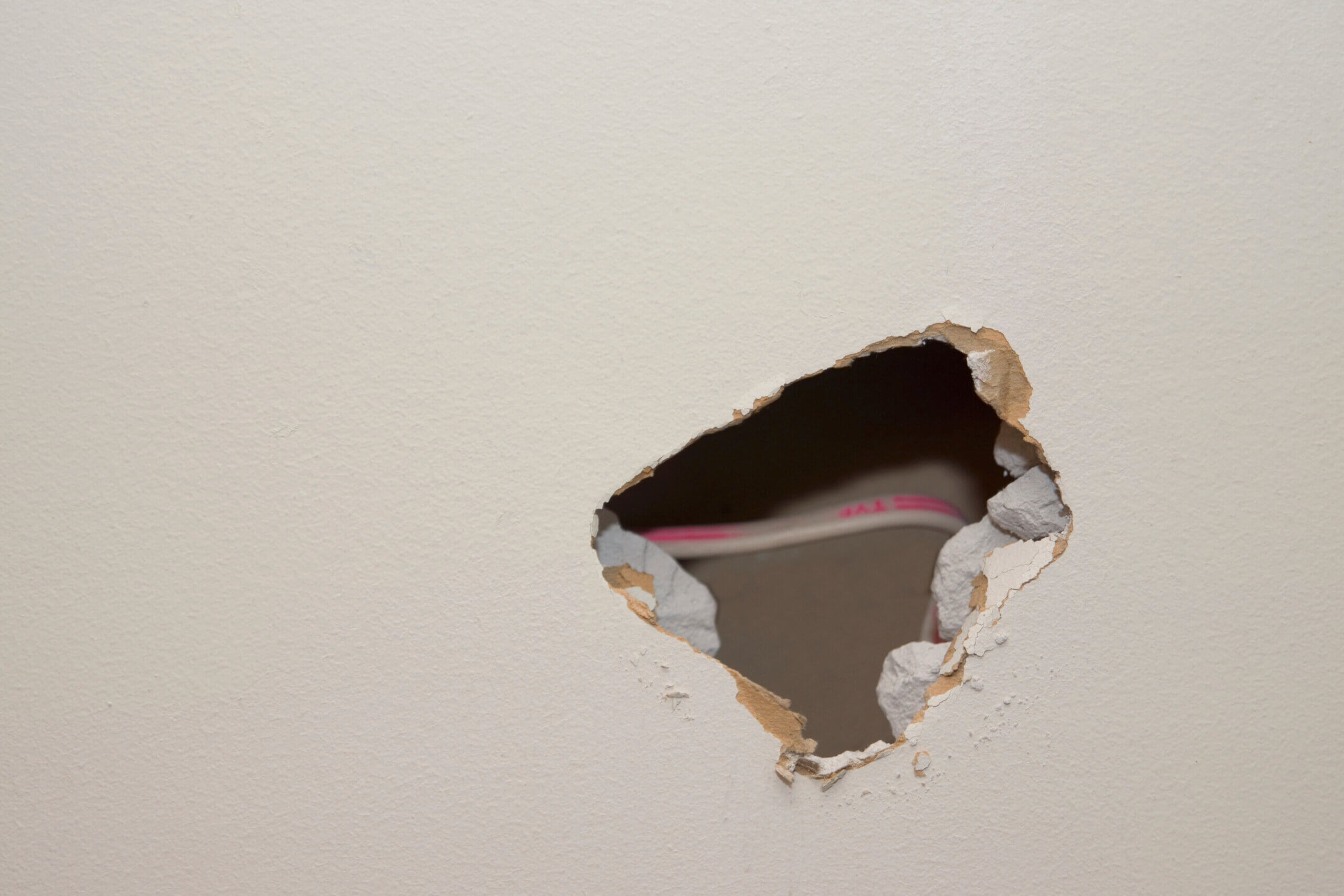 a close up picture of a hole in drywall in a home in Nashville Tennessee